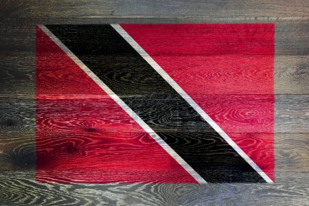 Photo for A Trinidad and tobago flag on rustic old wood surface background red white black diagonal - Royalty Free Image