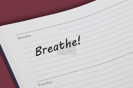 Photo for A Breathe reminder message in an open diary - Royalty Free Image
