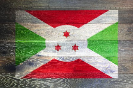 A Burundi flag on rustic old wood surface background red green stars
