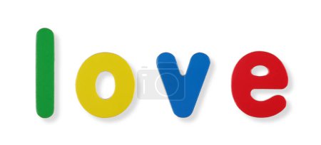 A love word in coloured magnetic letters on white with clipping path to remove shadow
