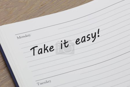 A Take it easy reminder message in an open diary
