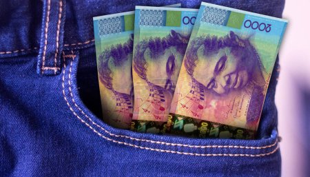 Bunch of Cape Verde 2000 Escudos banknotes in a jeans pocket a concept of spending