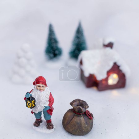 Photo for Christmas background with Santa Claus holding lantern and sack - Royalty Free Image