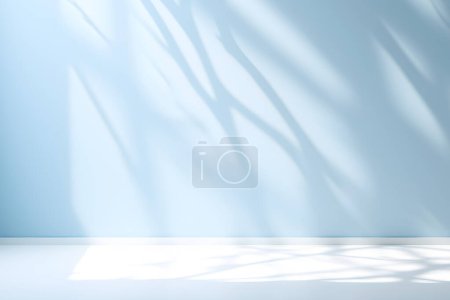 Photo for Empty light blue space with shadow from window on wall. Background or mockup for product presentation - Royalty Free Image