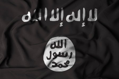 Der Islamische Staat im Irak und die Flagge der Levante wehen vor textilem Hintergrund. Illustration des Fahnenschwenkens. Selektiver Fokus