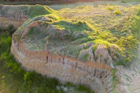 Photo for Aerial top view of sand quarry with green trees, slope of open pit. - Royalty Free Image