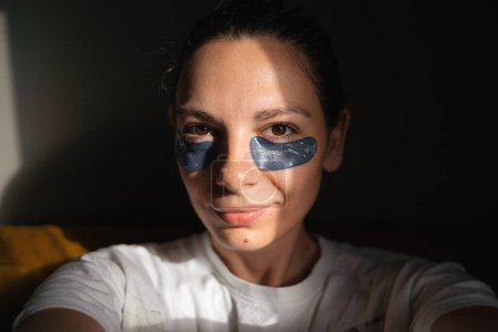 Photo for Young adult woman wearing eye patches in sun pocket. High quality photo - Royalty Free Image