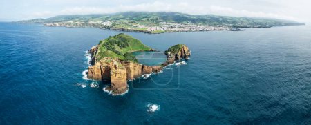Photo for Vila Franca Islet, also known as the Princess Ring is a vegetated uninhabited islet located off the south central coast of the island of Sao Miguel in the Portuguese archipelago of the Azores - Royalty Free Image