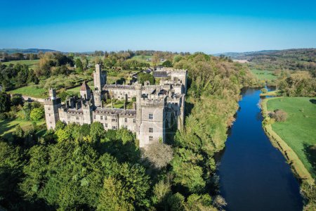 Photo for Aerial view of Lismore Castle, County Waterford, Ireland, on a tranquil spring day under a flawless blue sky - Royalty Free Image