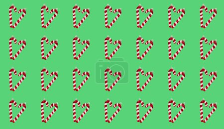 Foto de Patrón repetido de bastones de caramelo en forma de corazón sobre un fondo verde vibrante. Arreglo temático navideño con bastones de caramelo, bolas rosas y decoraciones estrella sobre un fondo verde pastel - Imagen libre de derechos