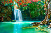 Waterfalls in the emerald blue water in Erawan National Park. Erawan Waterfall is a beautiful natural rock waterfall in Kanchanaburi, Thailand.Onsen atmosphere. t-shirt #640892122
