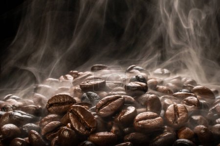 Photo for Coffee beans roasting with smoke,  selective focus, and soft focus. - Royalty Free Image