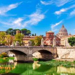The Aelian Bridge over the Tiber River and St Peters Cathedral, Rome, Italy.