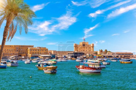 Photo for Alexandria harbour, boats near Qaitbay fort, point of the famous lighthouse, Egypt. - Royalty Free Image