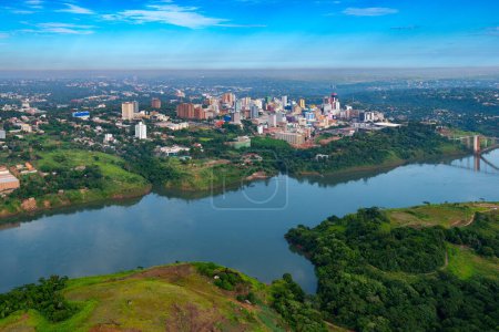 Photo for Aerial view of the Paraguayan city of Ciudad del Este and Friendship Bridge, connecting Paraguay and Brazil through the border over the Parana River,. - Royalty Free Image