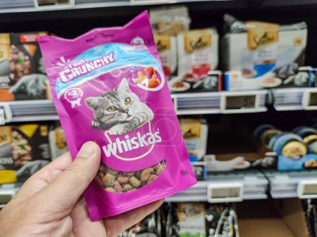 Photo for Surgeres, France - October 17, 2020:Customer Exploring Wet Cat Food Pouches Section "Whiskas" brand in a French Pet Store - Royalty Free Image