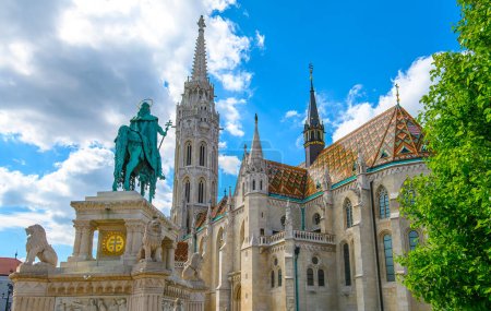 St. Stephen Statue and Matthias Church in Budapest, Hungary. A church located in front of the Fisherman's Bastion at the heart of Buda's Castle District.