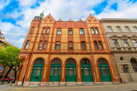 Photo for Front view the facade of beautiful old building with old sculptures in the city center of Szeged, Hungary - Royalty Free Image