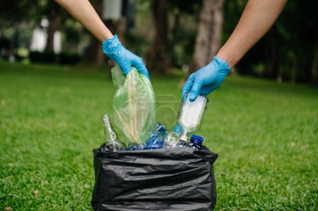 Photo for Eco activists cleaning park from garbage. pollution and ecology concept - Royalty Free Image