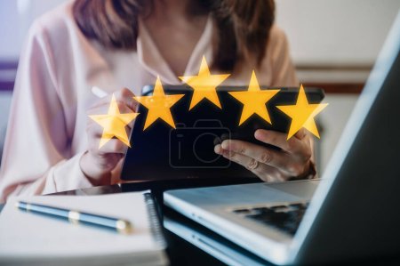 Photo for Customer or client the stars to complete five stars. with copy space. giving a five star rating. Service rating, satisfaction concept. at office - Royalty Free Image