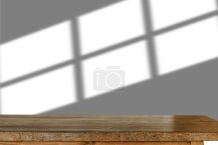Foto de Desk wood space platform at modern office in morning light For product display montage - Imagen libre de derechos