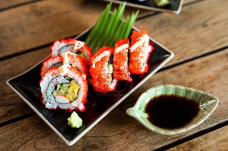 Téléchargez les photos : Sashimi, Sushi salmon & tuna sushi shrimp and wasabi on the wood table. Japanese food chopsticks - en image libre de droit