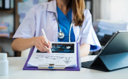 Téléchargez les photos : Medicine doctor hand working with modern digital tablet computer interface as medical network concept at hospital - en image libre de droit