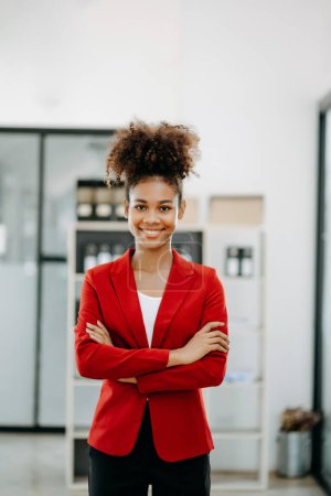 Photo for Confident  woman with a smile standing  the office - Royalty Free Image