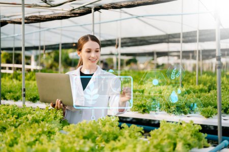 Photo for Researcher in white uniform are checking with ph strips in hydroponic farm and pH level scale graphic, science laboratory greenhouse concept. - Royalty Free Image