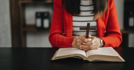 Photo for Woman praying on holy bible in the morning.Woman  with Bible praying. Christian life crisis prayer to god. - Royalty Free Image