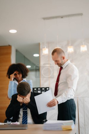 Photo for Team thinking of problem solution at modern office meeting, sad diverse business people group shocked by bad news, upset colleagues in panic after company bankruptcy concept - Royalty Free Image