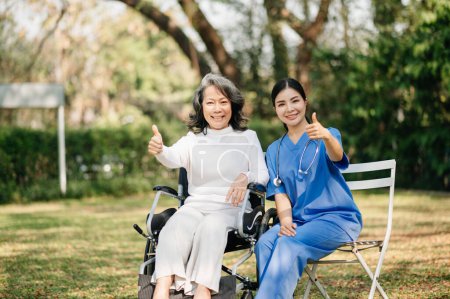 Photo for Asian female doctor woman and  old female patient with thumbs up - Royalty Free Image