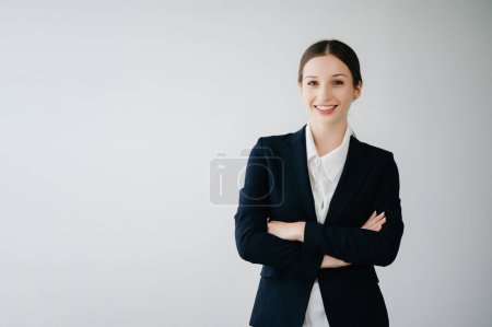 Photo for Smiling caucasian young businesswoman  looking at camera  isolated in white background - Royalty Free Image