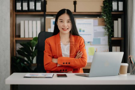 Photo for Asian Businesswoman using  laptop  in office - Royalty Free Image