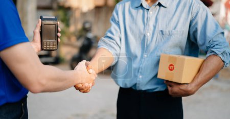 Photo for Parcel delivery with good depth of field. Friendly worker with high quality and shipping concept. - Royalty Free Image