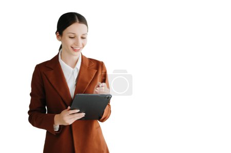 Photo for Smiling caucasian young businesswoman bank employee worker manager boss ceo looking at camera using tablet, laptop and notepad online isolated in white backgroun - Royalty Free Image