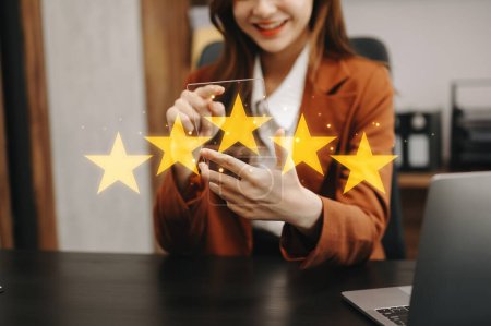 Photo for Customer or client the stars to complete five stars. with copy space. giving a five star rating. Service rating, satisfaction concept. in office - Royalty Free Image