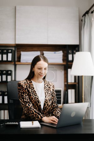 Photo for Portrait of female office businesswoman startup daydreaming about her work, startup and working with laptop on office desk in office room sitting at coffee sho - Royalty Free Image