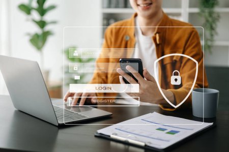 Photo for Cyber security concept, Login, User identification information. Secure access to user's personal information. Woman using smartphone and laptop in office - Royalty Free Image