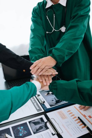 Photo for Team Doctors and nurses union coordinate hands ,Teamwork Concept in modern hospital for success and trust in the team - Royalty Free Image