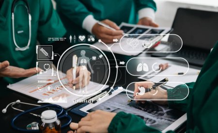 Photo for Medical technology network team meeting concept. Doctor hand working with smart phone modern digital tablet and laptop computer with graphics chart interface, with virtual icon - Royalty Free Image