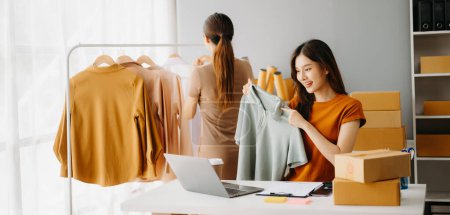 Photo for Fashion blogger concept, Young Asian woman selling clothes online. Startup small business SME - Royalty Free Image