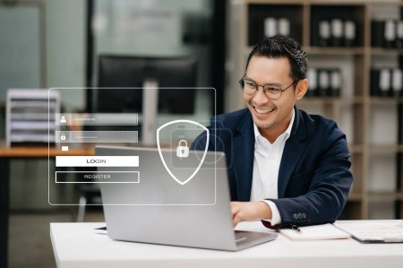 Photo for Cyber security concept, Login, User identification information. Secure access to user's personal information. Man using smartphone and laptop in office - Royalty Free Image