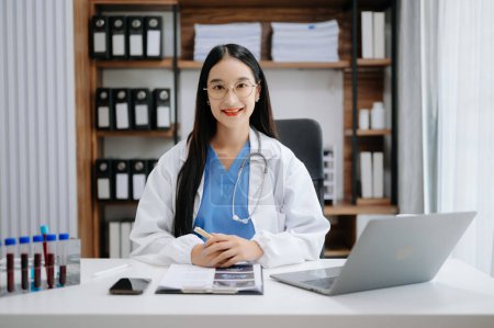 Photo for Medical technology concept. Asian Doctor working with stethoscope in modern office - Royalty Free Image