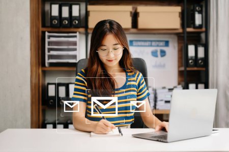 Photo for Asian Woman hands using Laptop and surfing the internet with email icon, email marketing concept, send e-mail or newsletter, online working internet network technology - Royalty Free Image
