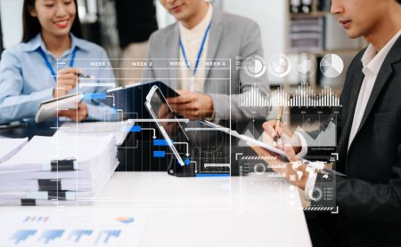 Photo for Business team working  on digital tablet in office. Gantt chart icon - Royalty Free Image