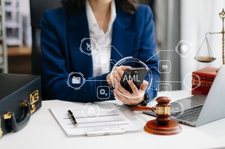 Photo for AML Anti Money Laundering Financial Bank Business Concept. judge in a courtroom using smartphone. AML anti money laundering icon - Royalty Free Image