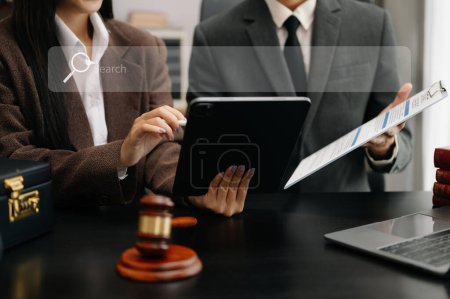 Photo for Searching Browsing Internet Data Information Networking Concept with blank search bar. justice and law concept.Male judge in a courtroom with the businesswoman, working with digital tablet computer - Royalty Free Image