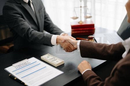 Photo for Man lawyer handshake with client at the modern office - Royalty Free Image