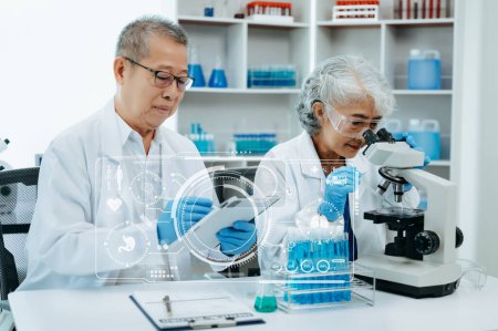 Photo for Scientist two Asian senior working in laboratory and ecofriendly science. Scientists analyzing test samples for global warming and tech with virtual icon screen - Royalty Free Image